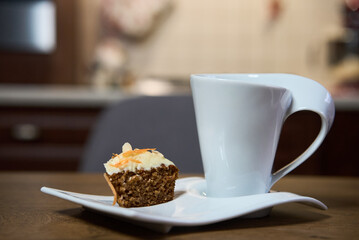 Muffins with carrot, walnuts and cinnamon. Delicious homemade appetizer.