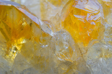 Heat threated amethyst, yellow amethyst close up in the light . Citrine point