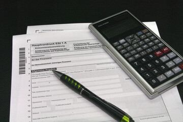 Germany, symbol photo, tax return form with pen and calculator