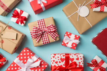 Top view photo of saint valentine's day decorations presents different gift boxes with bows on isolated pastel blue background