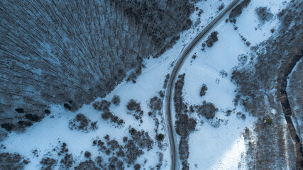 Winter forests in the mountains with white snow. Top view