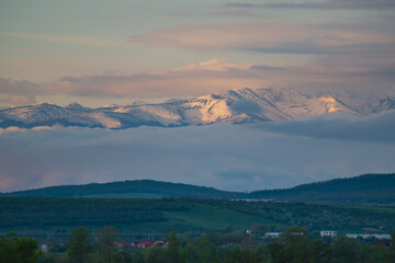 cover with snow mountains in the morning