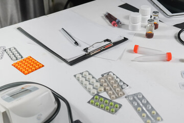 Medicine, doctor sitting at the table and writing a prescription to the patient, remote visit, online treatment, top view, medical background,