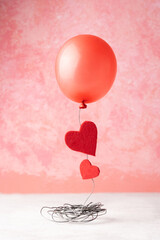 Red balloon and two red hearts, Valentine's day concept.