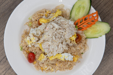 Overhead view of generous helping of fried rice with shredded crab meat for a delicious pile of Thai food to eat