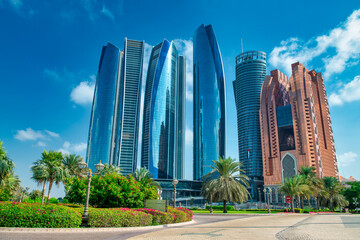 Fototapeta na wymiar Buildings and skyscrapers of Abi Dhabi along Corniche Road on a sunny day, UAE.
