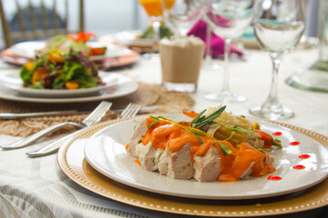 Laid table with vegetables, salads and drinks. Festive table with food. Elegant meal