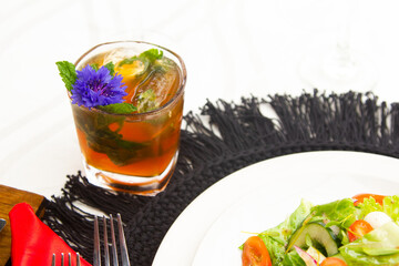 Laid table with vegetables, salads and drinks. Festive table with food. Elegant meal