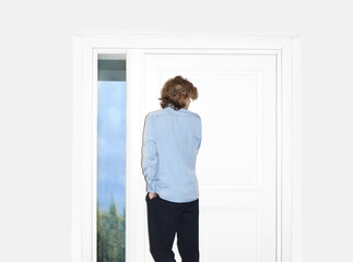 Man opening the door of her home.Inviting the guests