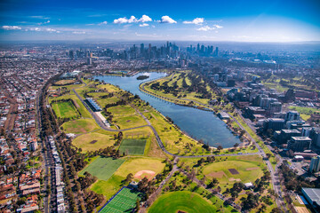 Fototapeta premium Melbourne, Australia. Aerial city skyline from helicopter. Skyscrapers, park and lake.