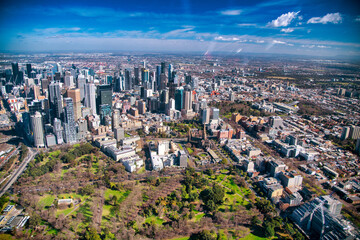 MELBOURNE, AUSTRALIA - SEPTEMBER 8, 2018: Aerial city skyline from helicopter. Downtown skyscrapers and park.