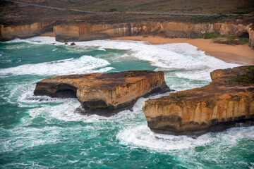 Aerial view of the Loch Ard Gorge area with limestone stacks from helicopter, Australia.