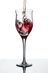 Serving a beautiful glass with a deliciuos red wine. White background, glass cup. Elegance, good taste, style concept.