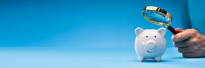 Fototapeta Businessman Looking For Money In Piggy Bank obraz