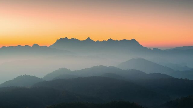 Sunrise over Doi Luang Chiang Dao mountain and foggy on hill in national park from Doi Kham Fah viewpoint at Chiang Dao