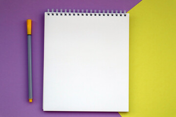 Bright stationery, notebook on pink yellow background. Back to school, workspace concept. Top view, flat lay