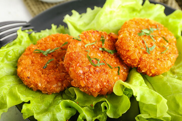 Plate with tasty lentil cutlets, closeup