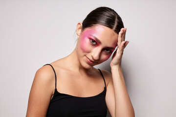 pretty woman pink face makeup posing attractive look light background unaltered