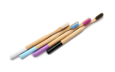Bamboo toothbrushes on white background
