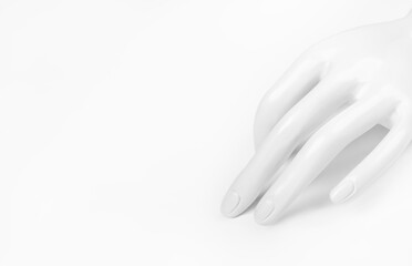 ladies' plastic white hand for rings on white background.