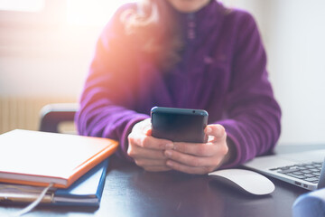 Businesswoman hand working digital marketing media in virtual screen with mobile phone and modern compute in office