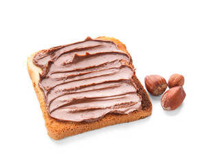 Bread with chocolate paste and hazelnuts on white background