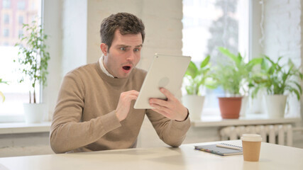 Man making Video Call on Tablet in Office