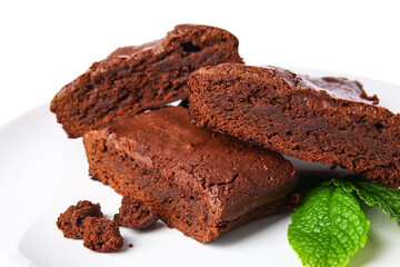Pieces of tasty chocolate brownie isolated on white background, closeup