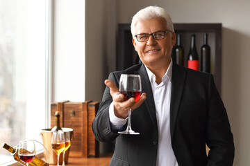 Mature sommelier tasting types of wine