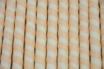 Sweet crunchy tubes lined up as a background.