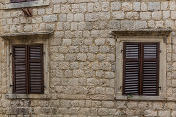 Windows of an old stone building in Kotor, Montenegro.