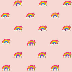 Colorful rainbow with clouds at the ends on pastel light pink background. Creative cute pattern. Minimal flat lay concept.