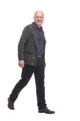 Mature man in casual clothes striding forward.