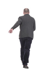 Naklejka premium Mature man in casual clothes striding forward.