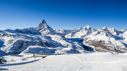 Fototapeta na wymiar Matterhorn panorama - the most famous landmark in Swiss Alps mountains with popular skiing area (large stitched file)