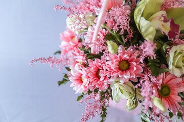 Tender pink chrysanthemum bouquet in a basket. Romantic background. Greeting card