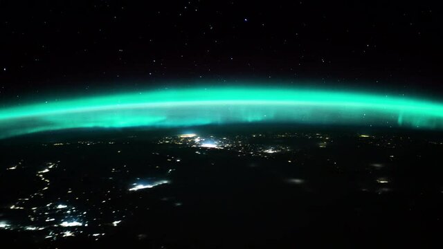 Spectacular aurora borealis and sunrise time lapse view from space station orbiting on planet earth. Animation based on images by Nasa