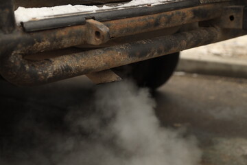 Smoke from the exhaust pipe of a car