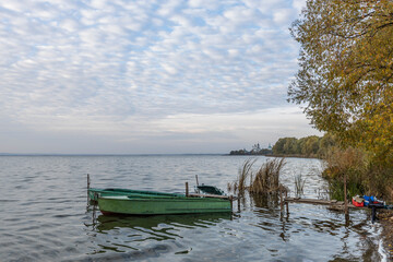 Colorful sunrise on the shores of Lake Nero. Autumn landscape with a lake in the early morning. A...