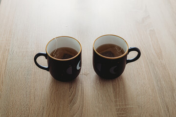 Two cups of tea on the wooden table