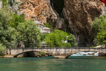 Fototapeta na wymiar Stone bridge over Buna river in Blagaj village near Mostar, Bosnia and Herzegovina