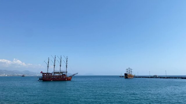 An old pirate ship at sea on a clear sunny day