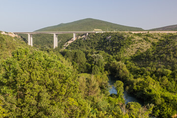 Fototapeta na wymiar Motorway bridge over Trebizat river near Kravica waterfalls in Bosnia and Herzegovina
