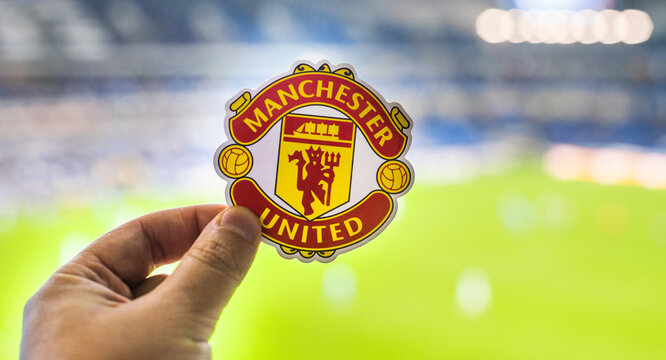 August 30, 2021, Manchester, UK. Manchester United F.C. Football Club Emblem Against The Backdrop Of A Modern Stadium.