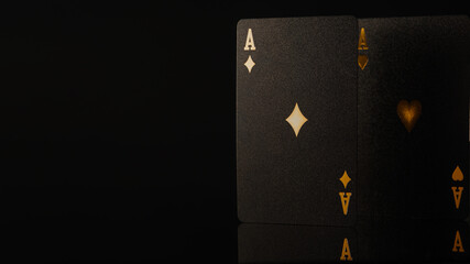 One black poker card - an ace of diamonds on a black background. Close-up. Minimalism. There are no people in the photo. There is a place to insert. Casino, online casino, gambling.