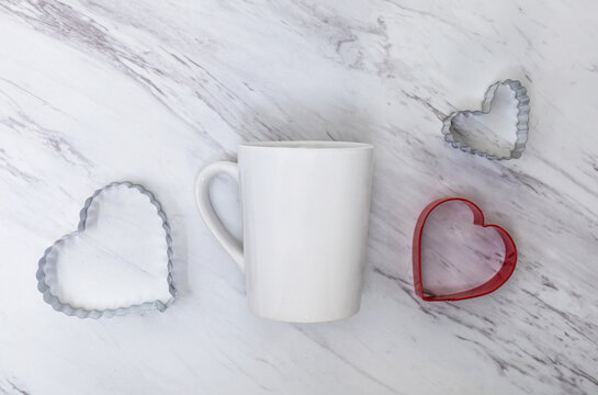White mug mockup on white marble background with heart shapes flat lay for Valentine's Day, Mother's Day, Anniversary, Baking, Romance, add your text, logo, artwork