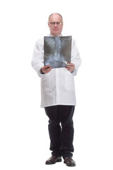 mature doctor in a white coat striding forward