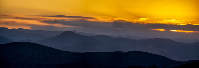 Fototapeta na wymiar Panorama of Mountains at Sunset