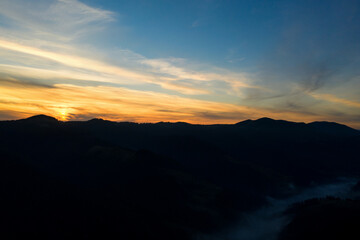 Silhouette of mountain landscape at sunset. Drone photography