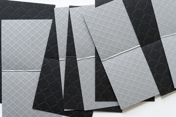 silver and black paper on white (with fold marks)